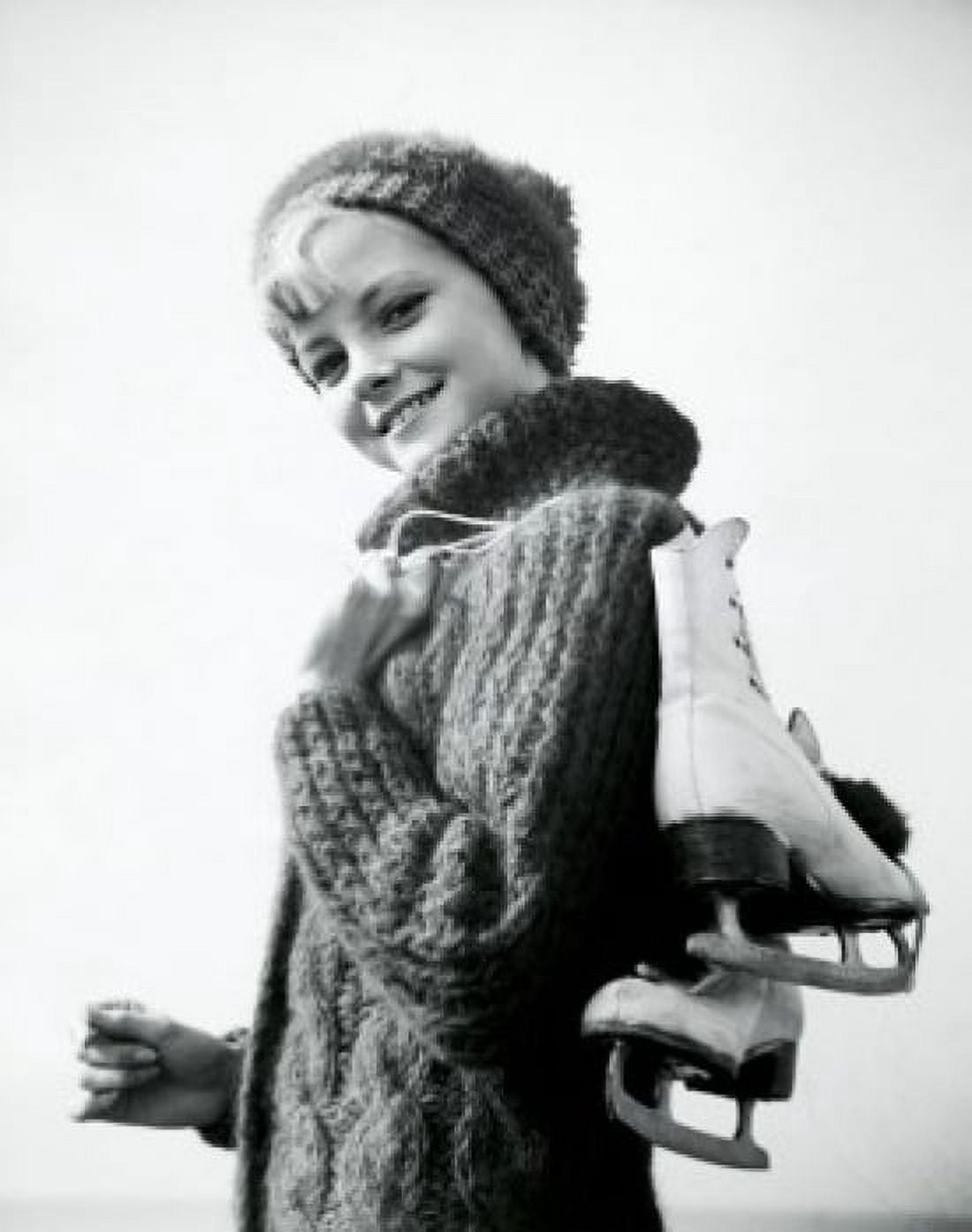 Portrait of a teenage girl carrying a pair of ice skates Canvas Art - (24 x 36)