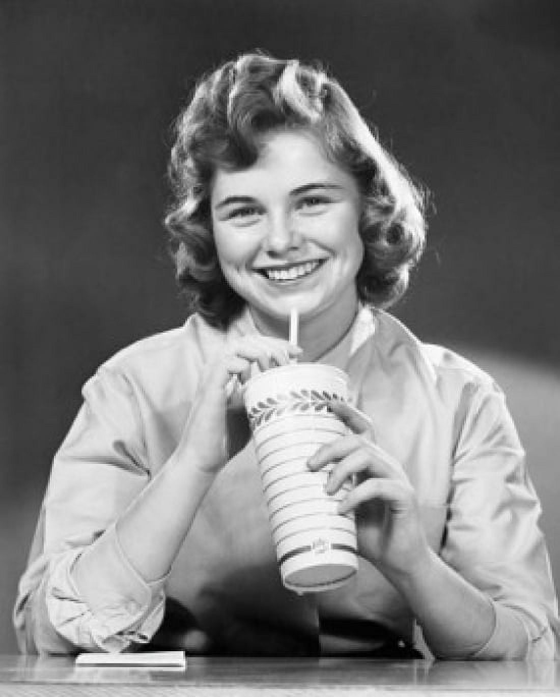 Portrait of a teenage girl drinking out of a disposable cup with straw Canvas Art - (24 x 36)