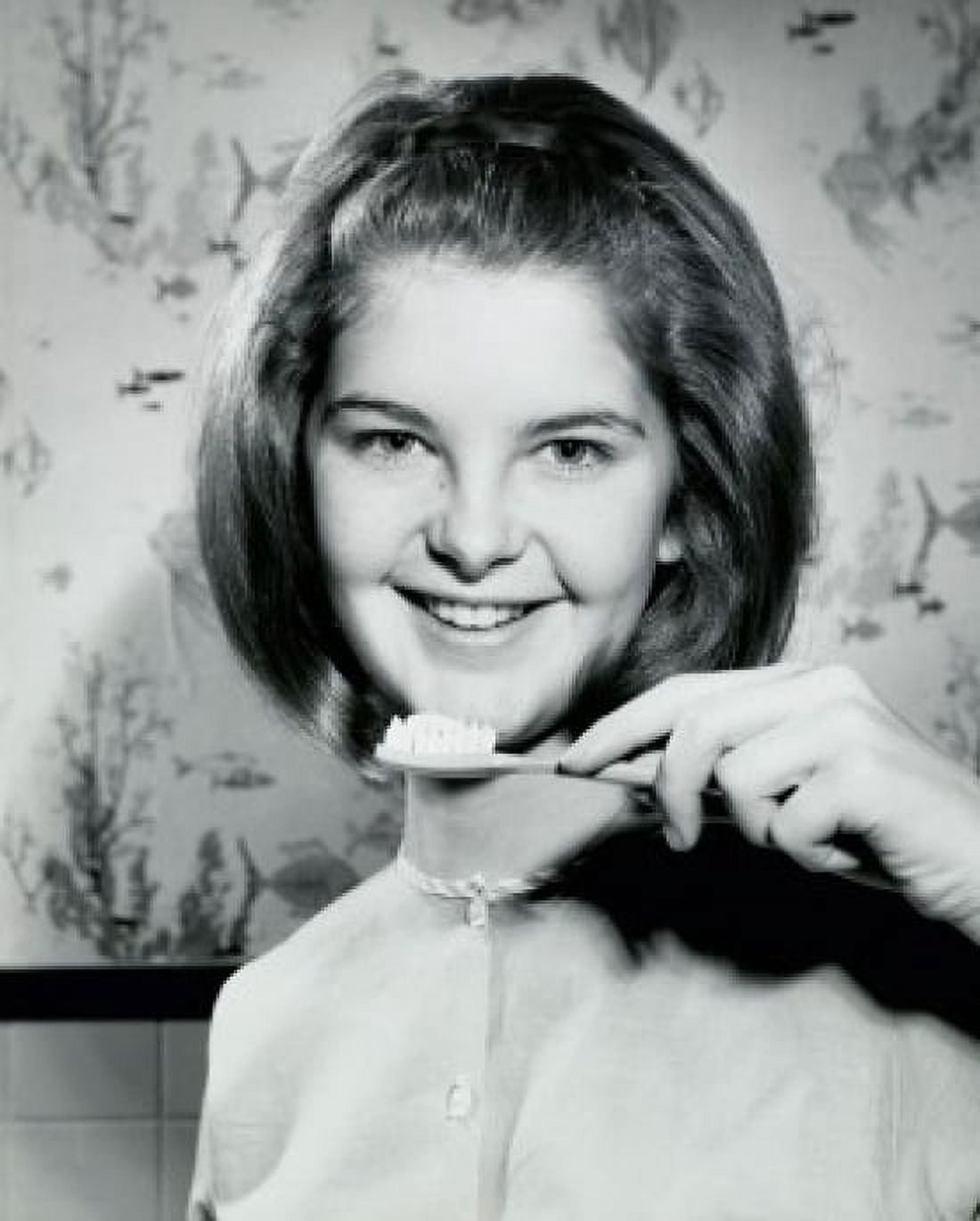 Portrait of a teenage girl holding a toothbrush and smiling 1966 Canvas Art - (24 x 36)