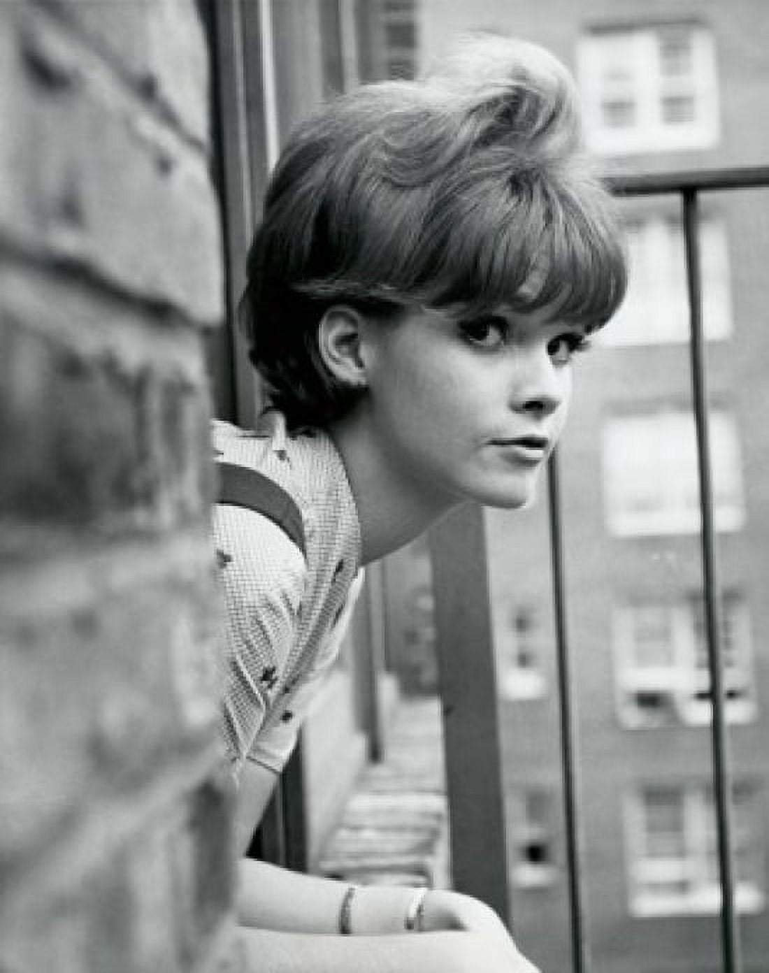 Portrait of a teenage girl leaning out of a window Canvas Art - (24 x 36)