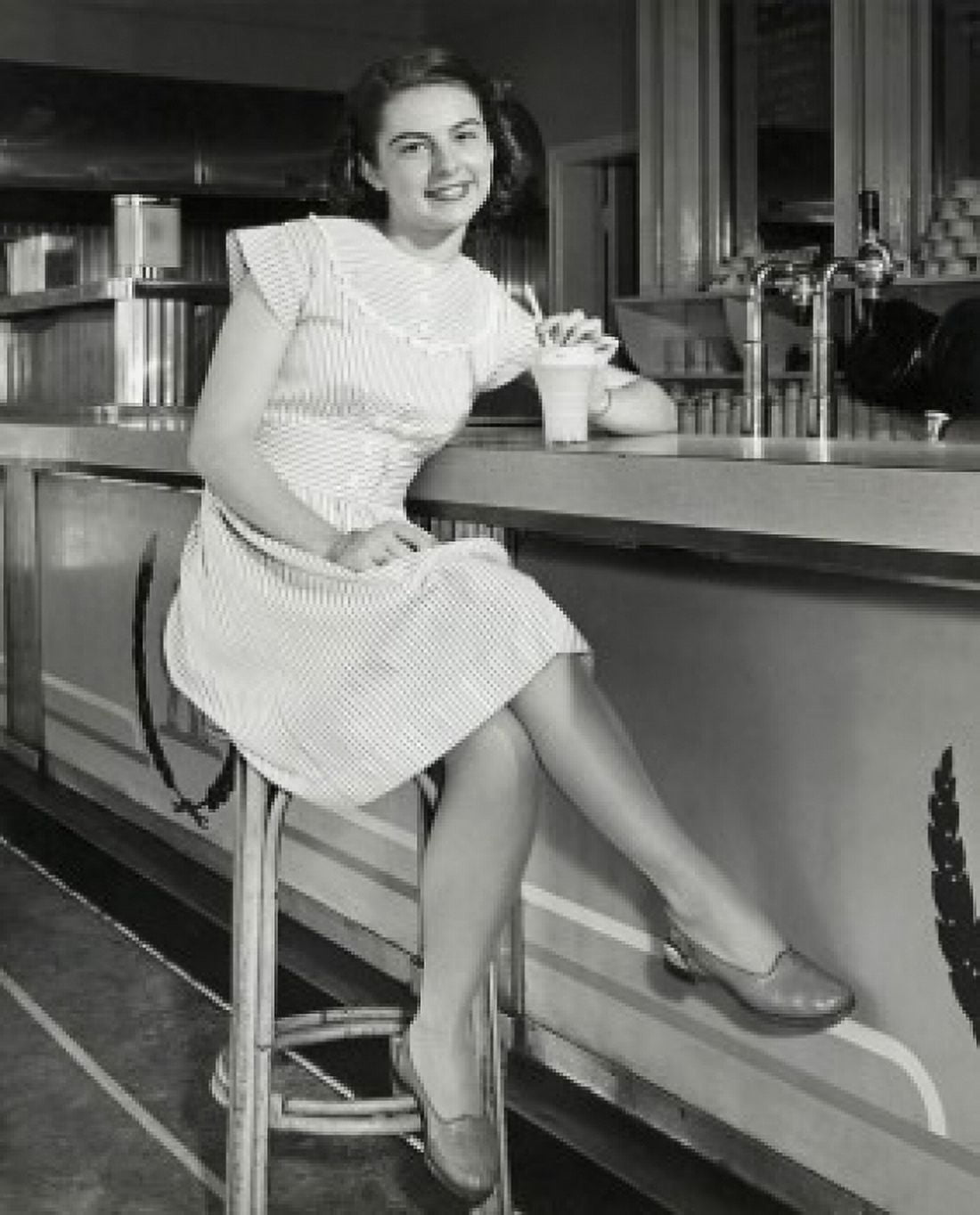 Portrait of a teenage girl sitting in a cafe and smiling 1947 Canvas Art - (18 x 24)