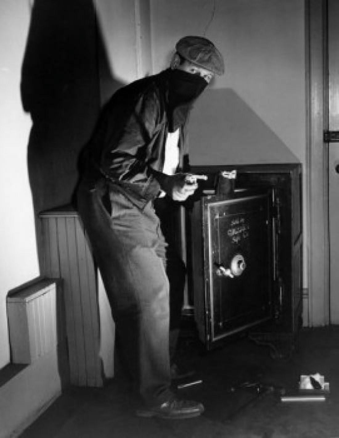 Portrait of a thief standing near an open safe Canvas Art - (24 x 36)
