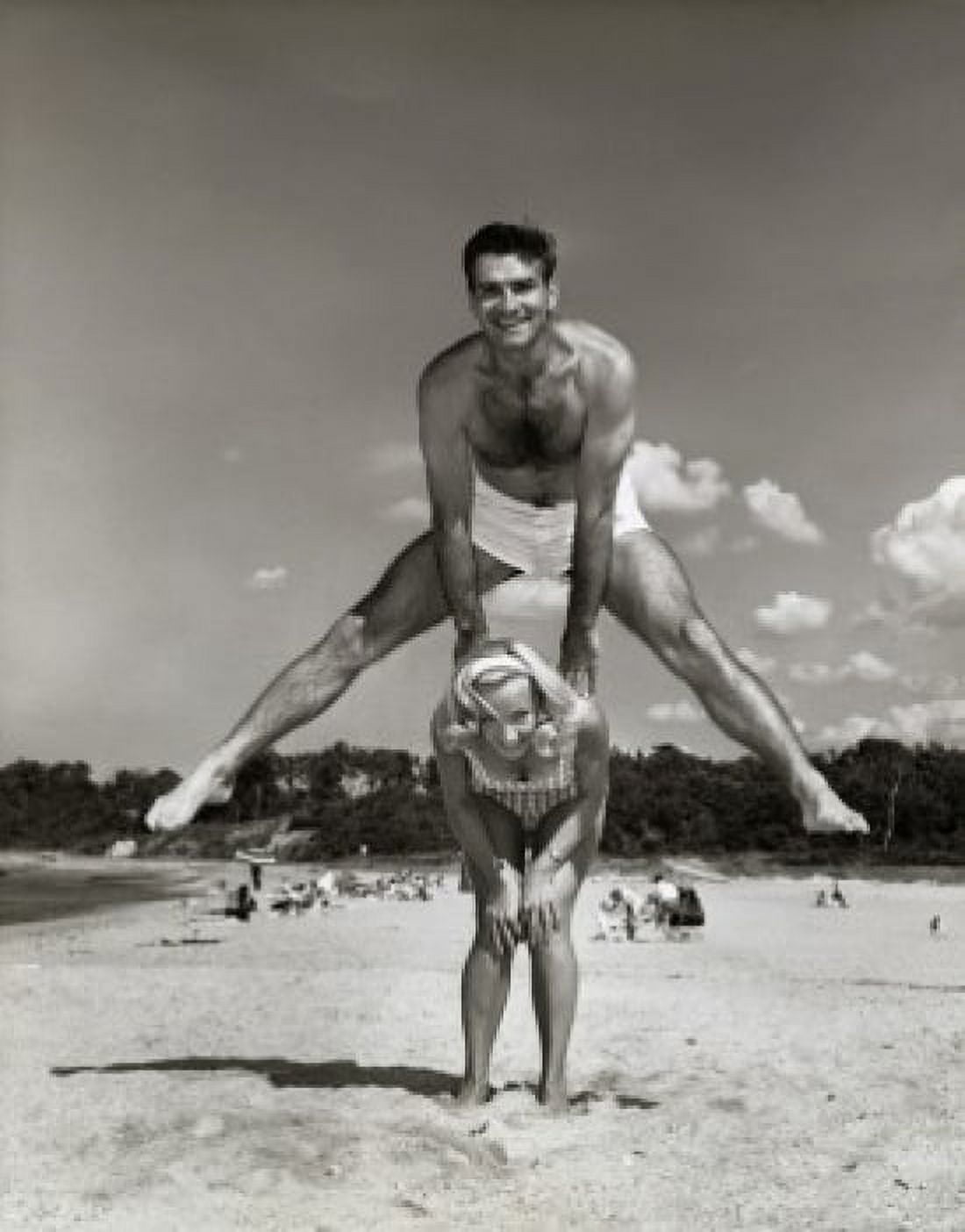Portrait of a young couple playing leapfrog on the beach Canvas Art - (18 x 24)