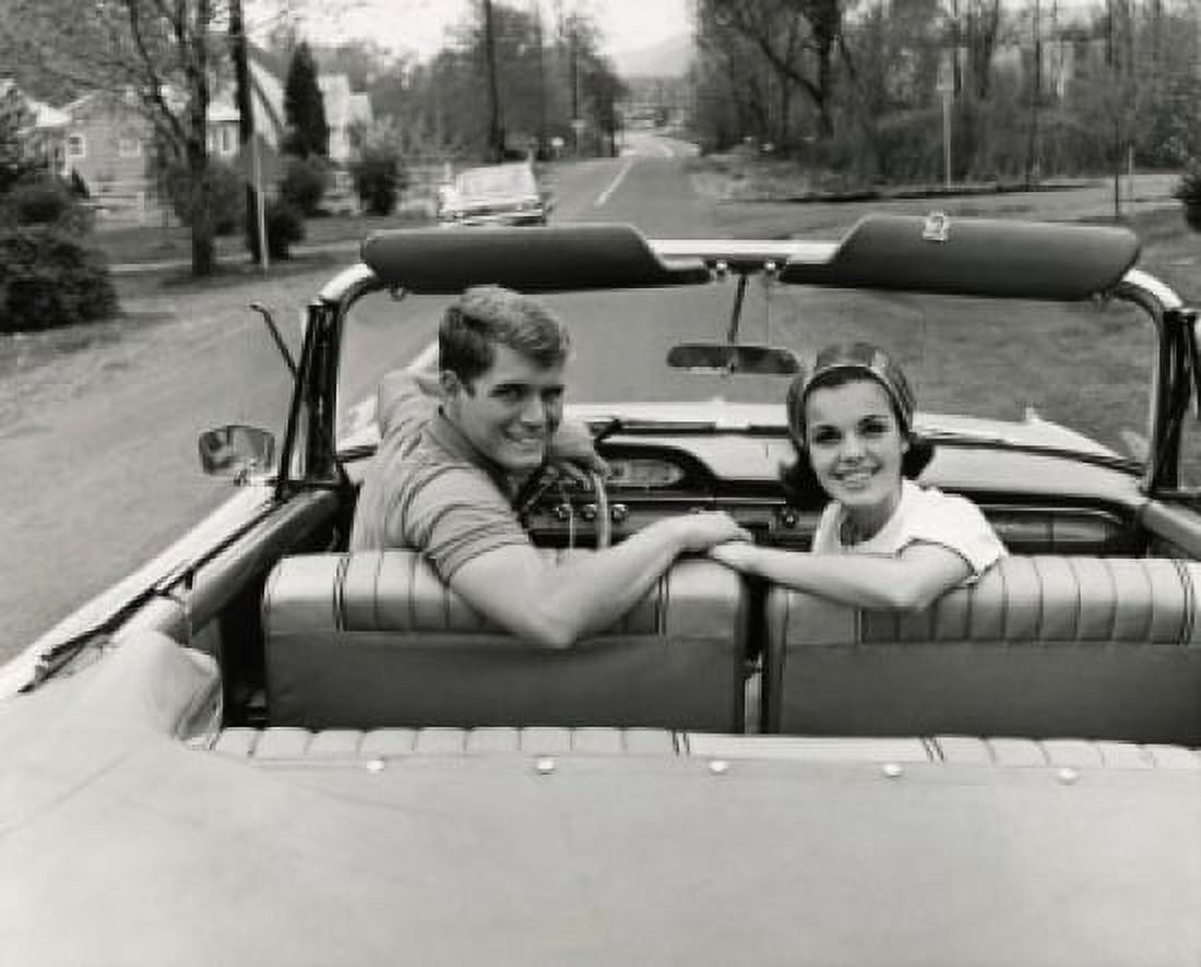 Portrait of a young couple sitting in a convertible car Canvas Art - (18 x 24)