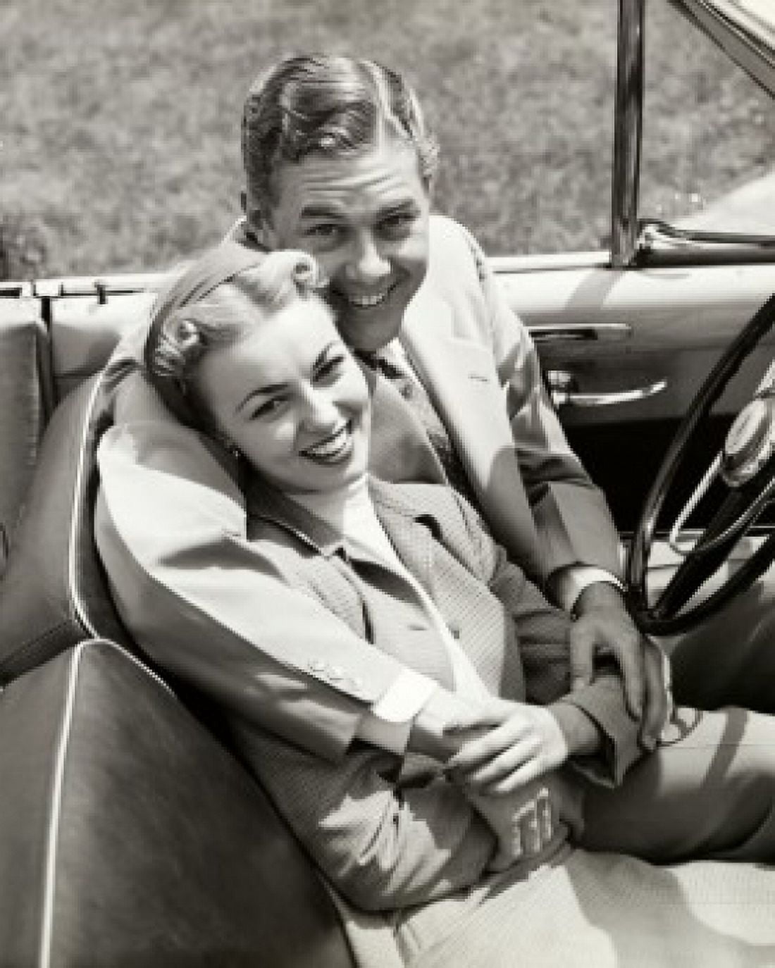 Portrait of a young couple sitting in a convertible car Canvas Art - (18 x 24)