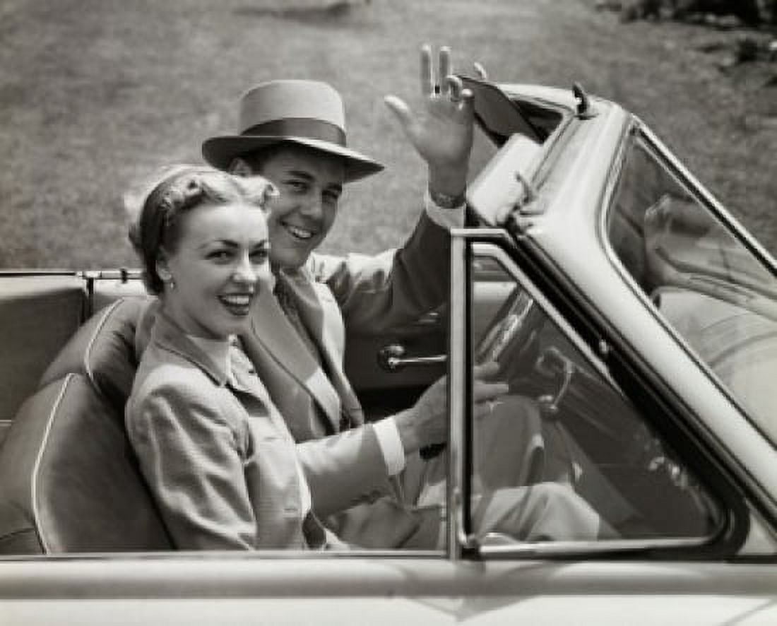 Portrait of a young couple sitting in a convertible car Canvas Art - (24 x 36)