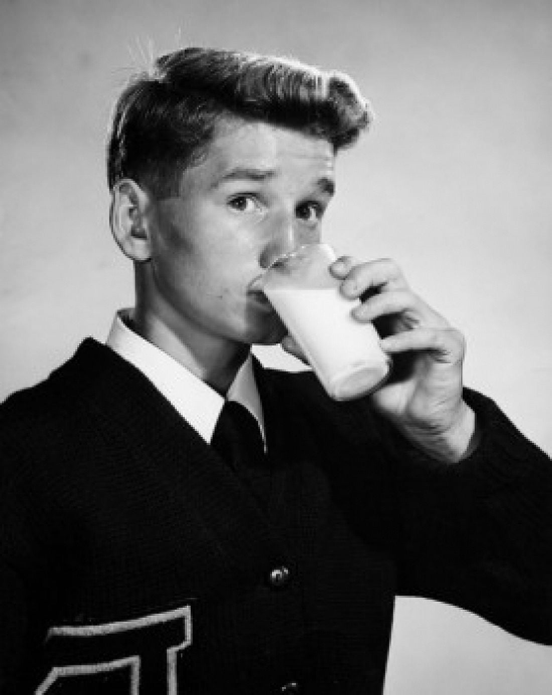Portrait of a young man drinking milk Canvas Art - (18 x 24)