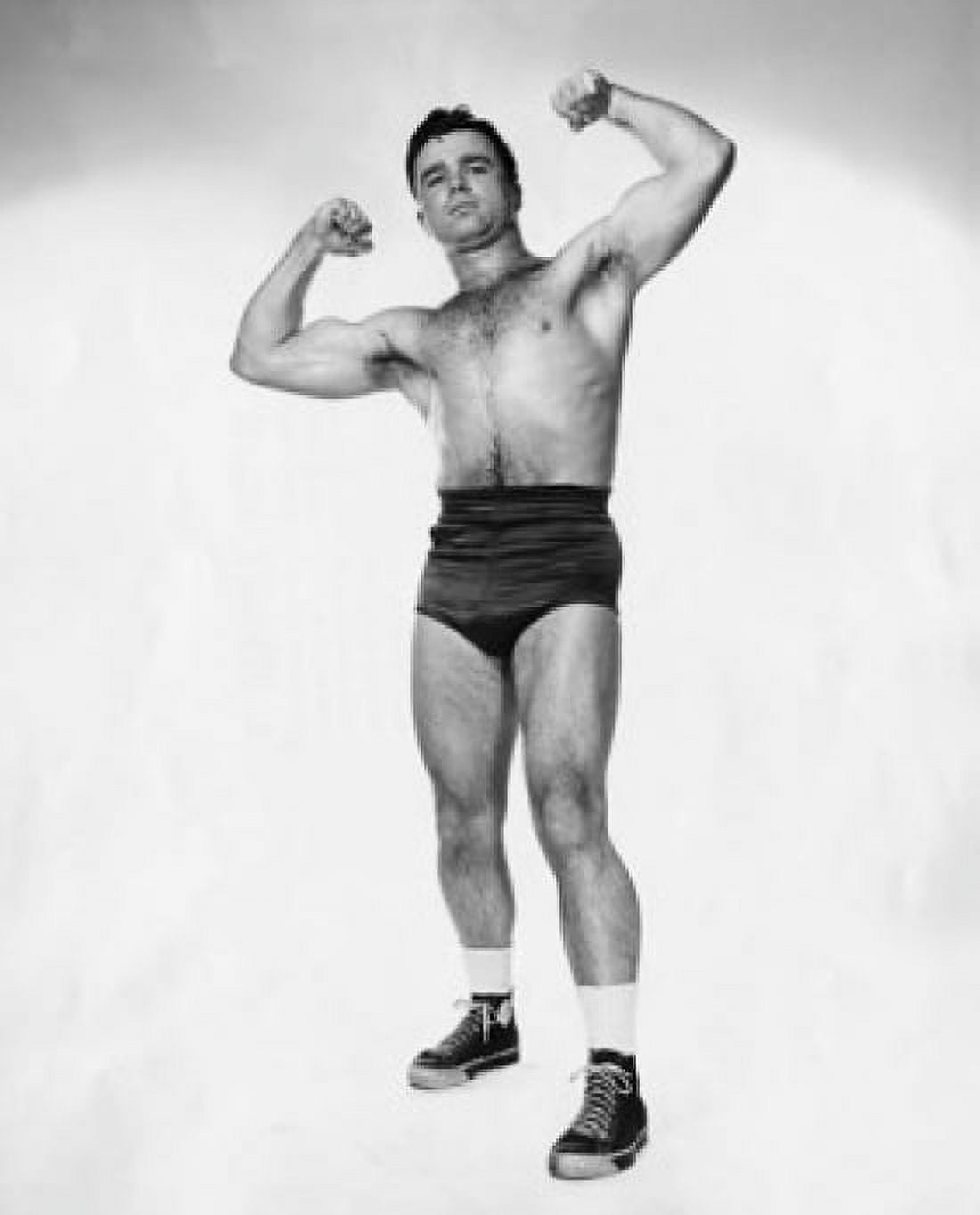 Portrait of a young man flexing his muscles Canvas Art - (24 x 36)