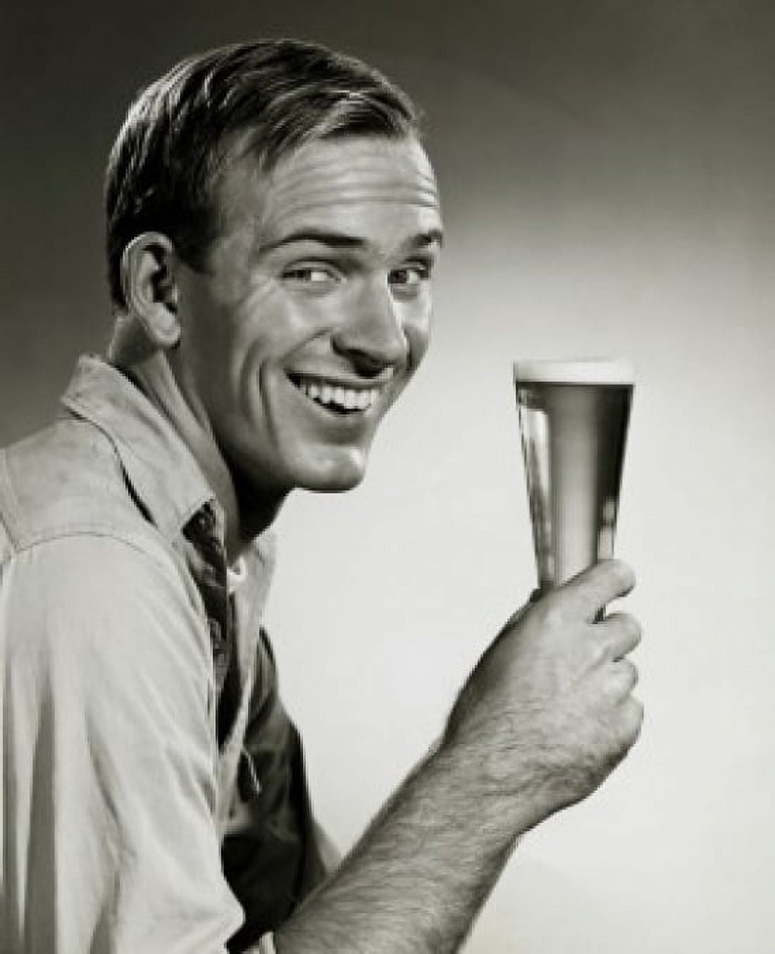 Portrait of a young man holding a glass of beer Canvas Art - (18 x 24)