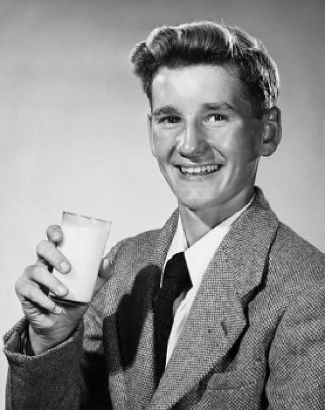 Portrait of a young man holding a glass of milk Canvas Art - (18 x 24)