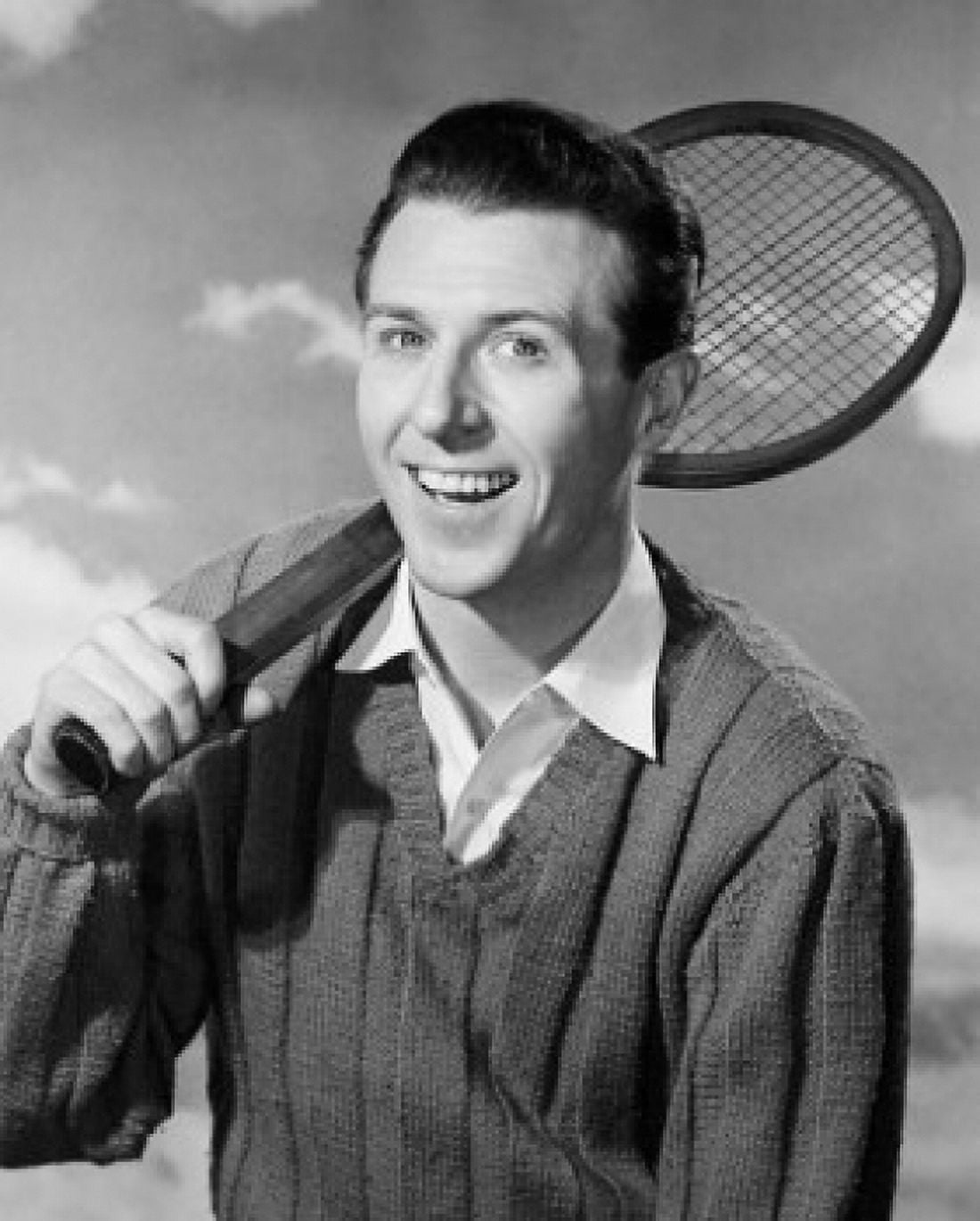Portrait of a young man holding a tennis racket and smiling Canvas Art - (24 x 36)
