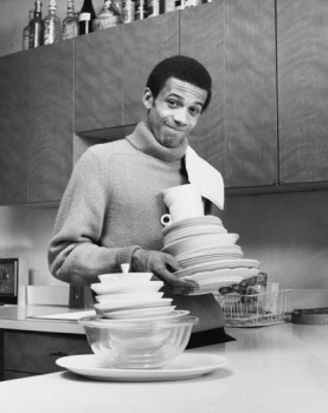Portrait of a young man holding dishes Canvas Art - (24 x 36)