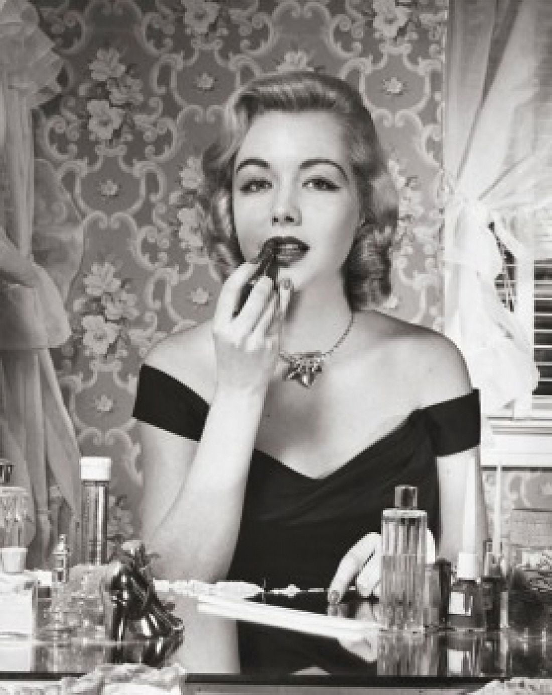 Portrait of a young woman applying lipstick Canvas Art - (18 x 24)