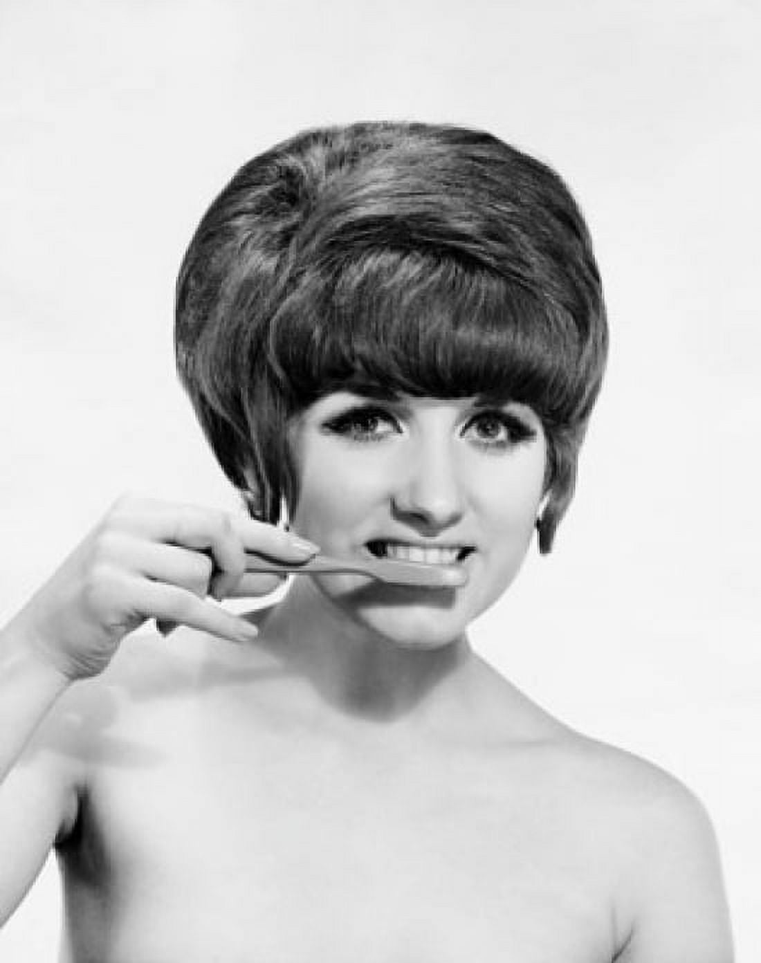 Portrait of a young woman brushing her teeth Canvas Art - (18 x 24)