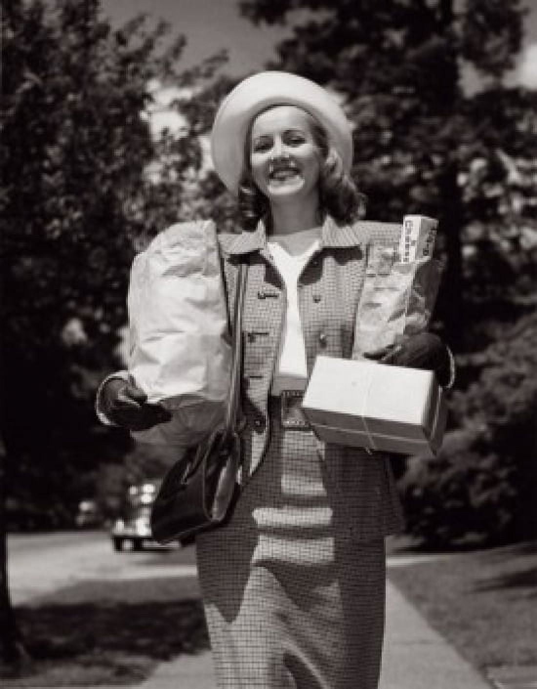 Portrait of a young woman carrying groceries Canvas Art - (18 x 24)