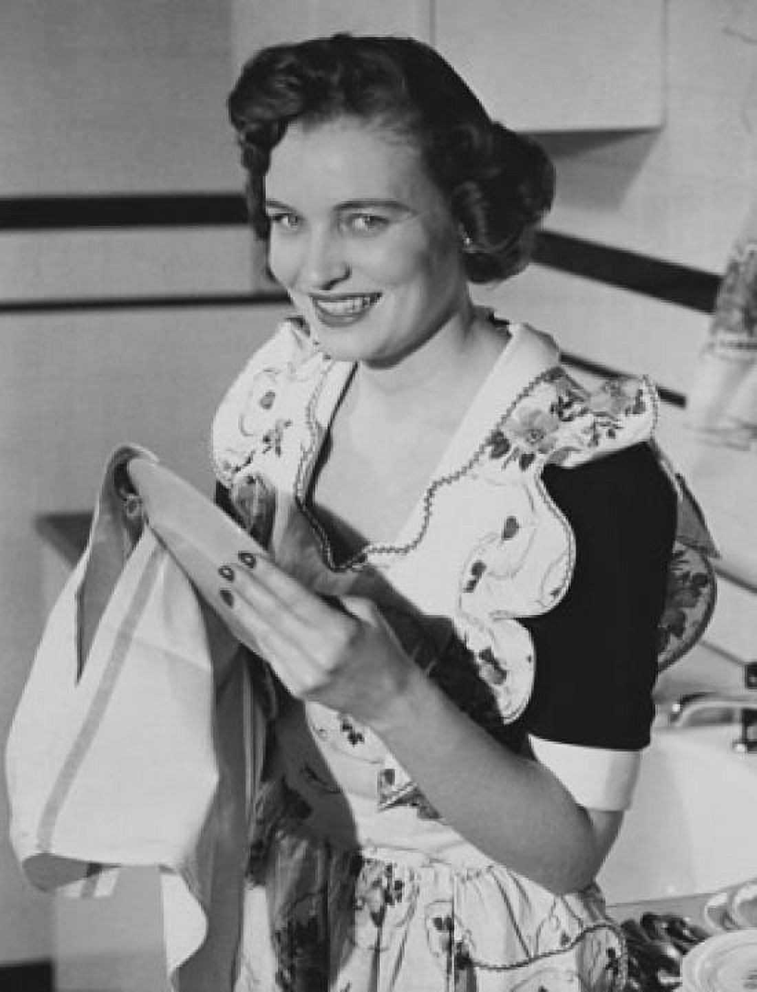 Portrait of a young woman cleaning a plate with a dishcloth Canvas Art - (18 x 24)