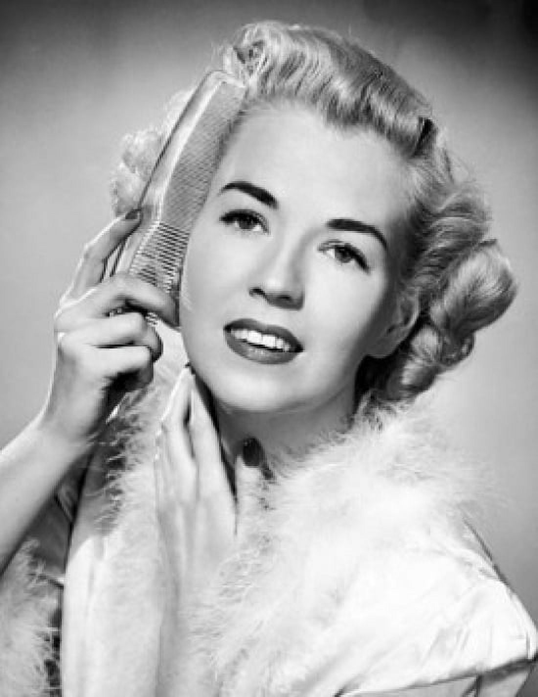 Portrait of a young woman combing her hair Canvas Art - (18 x 24)