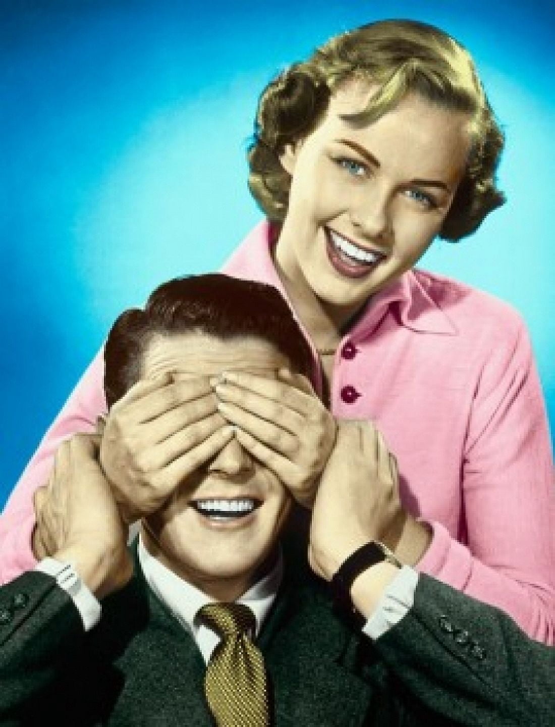 Portrait of a young woman covering a young mans eyes with her hands and smiling Canvas Art -  (24 x 36)