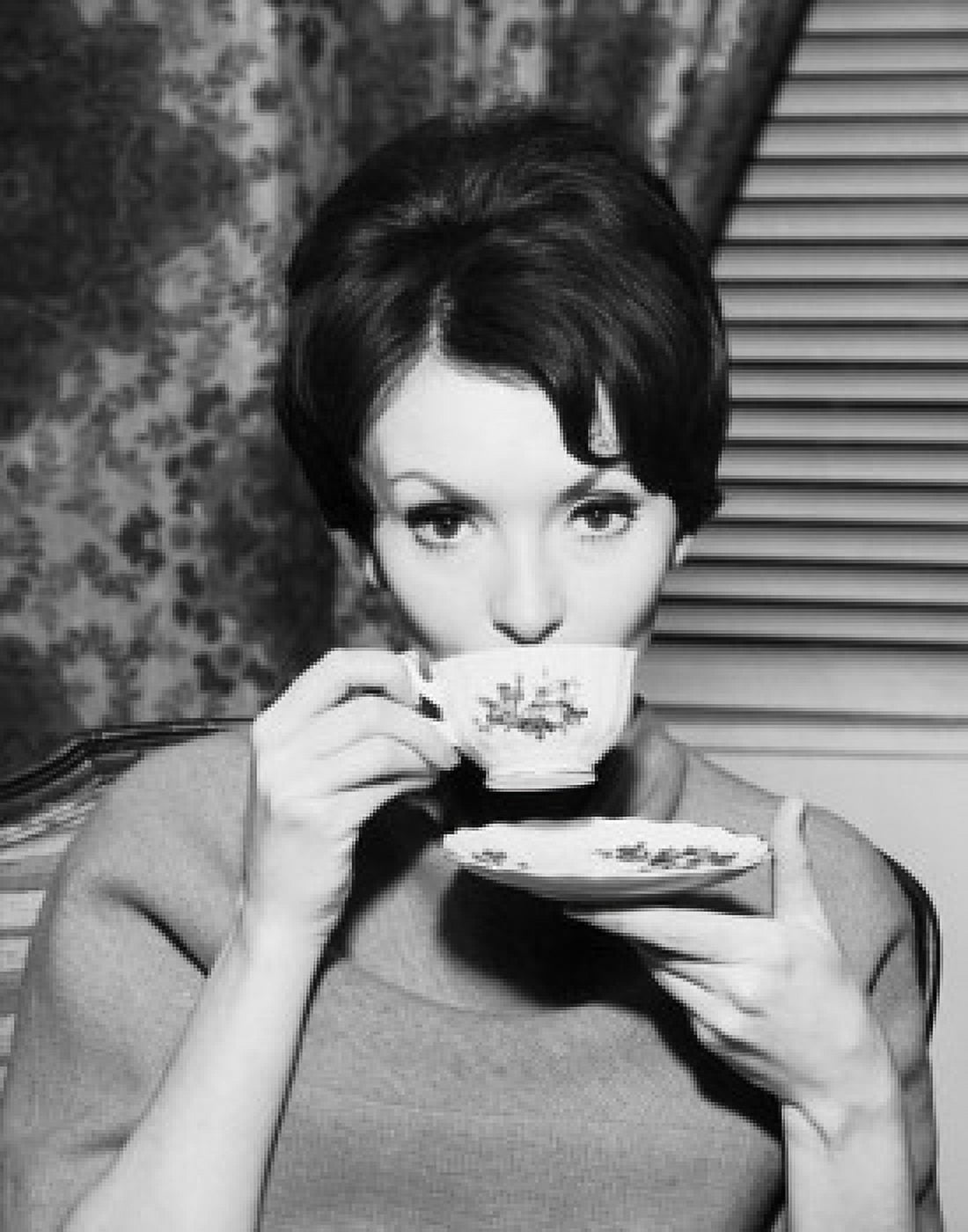 Portrait of a young woman drinking from a tea cup Canvas Art - (18 x 24)