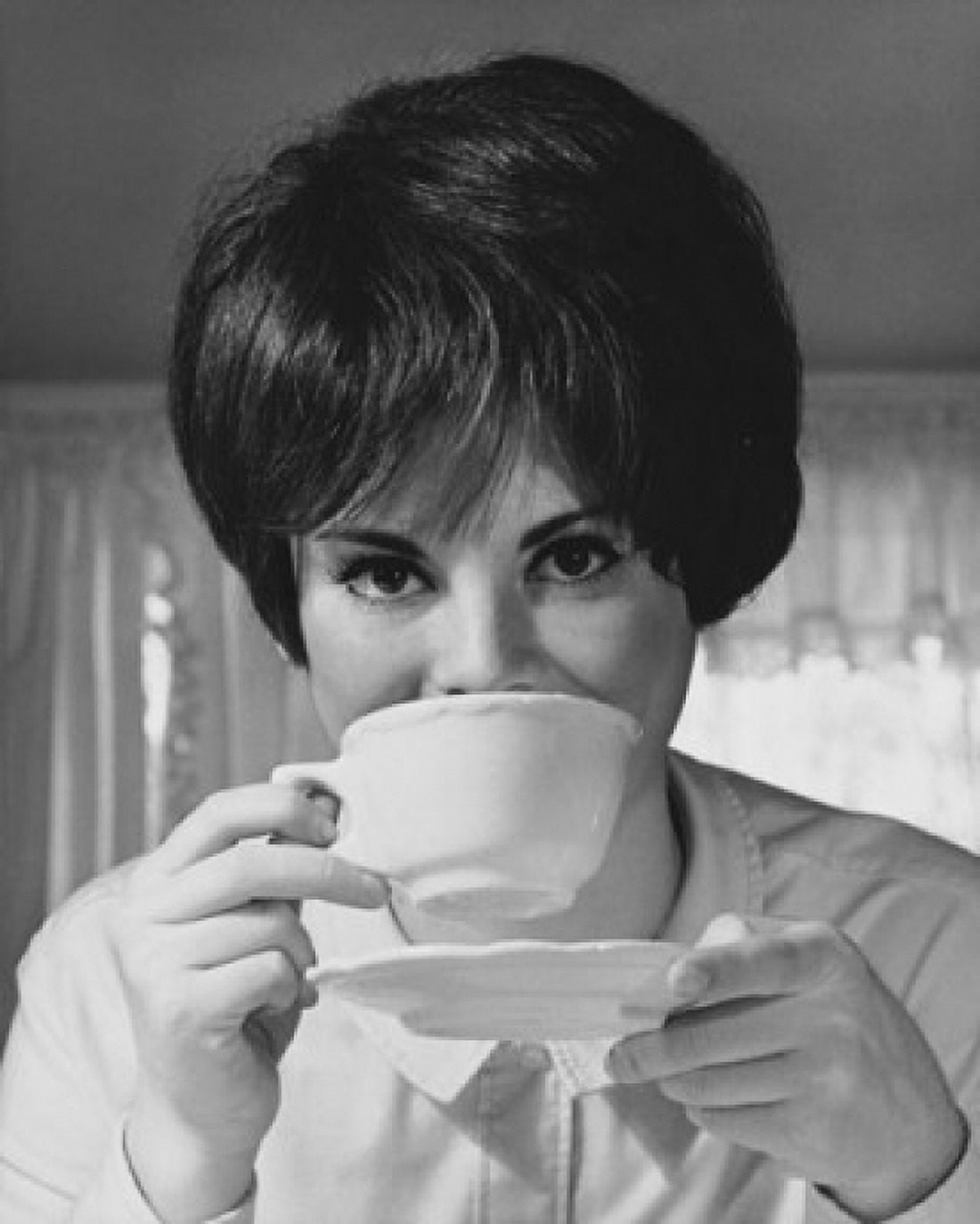 Portrait of a young woman drinking from a tea cup Canvas Art - (18 x 24)