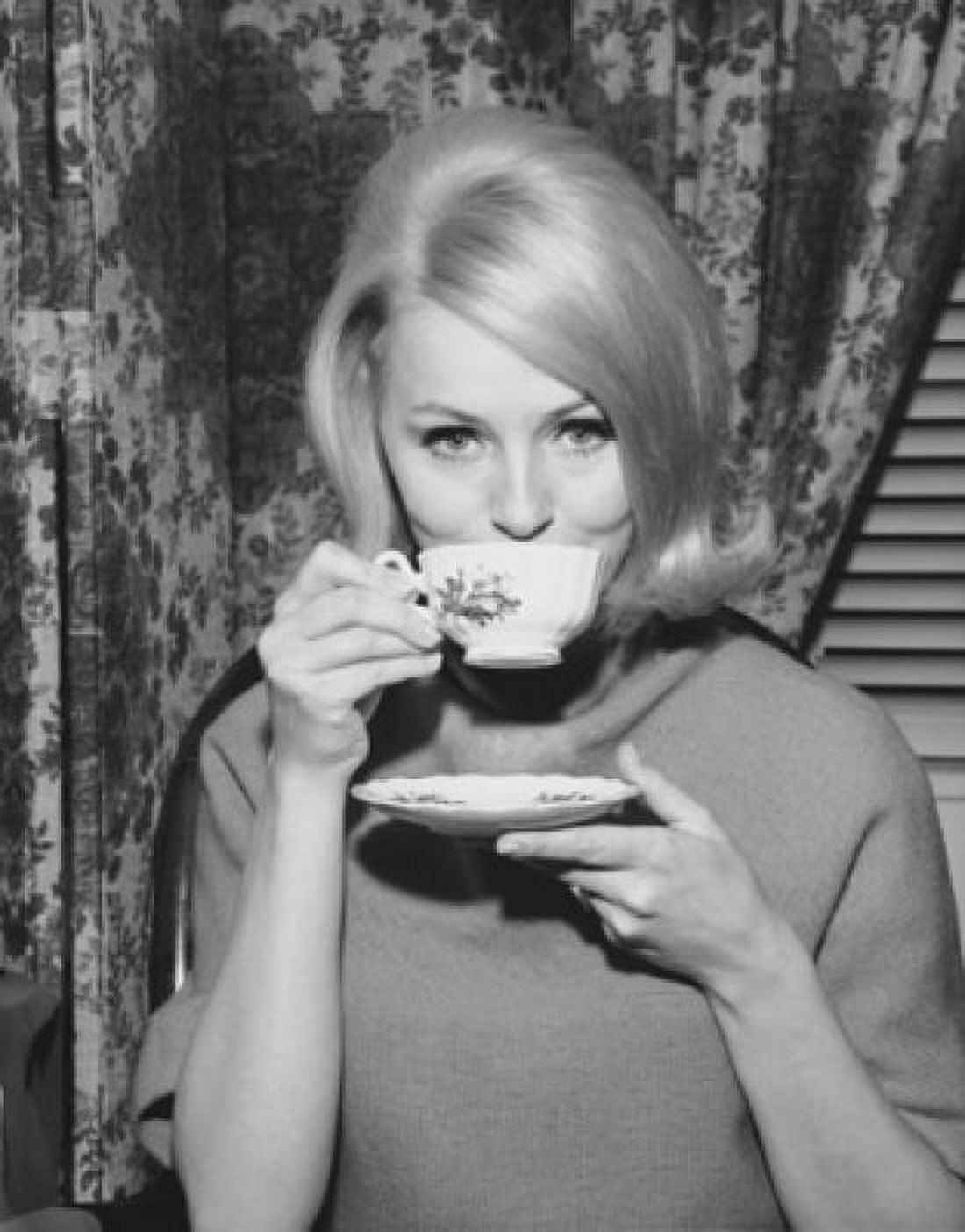 Portrait of a young woman drinking from a tea cup Canvas Art - (24 x 36)