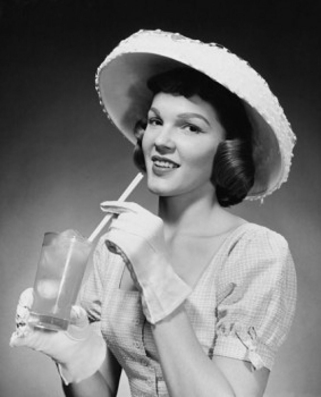 Portrait of a young woman drinking lemonade Canvas Art - (24 x 36)