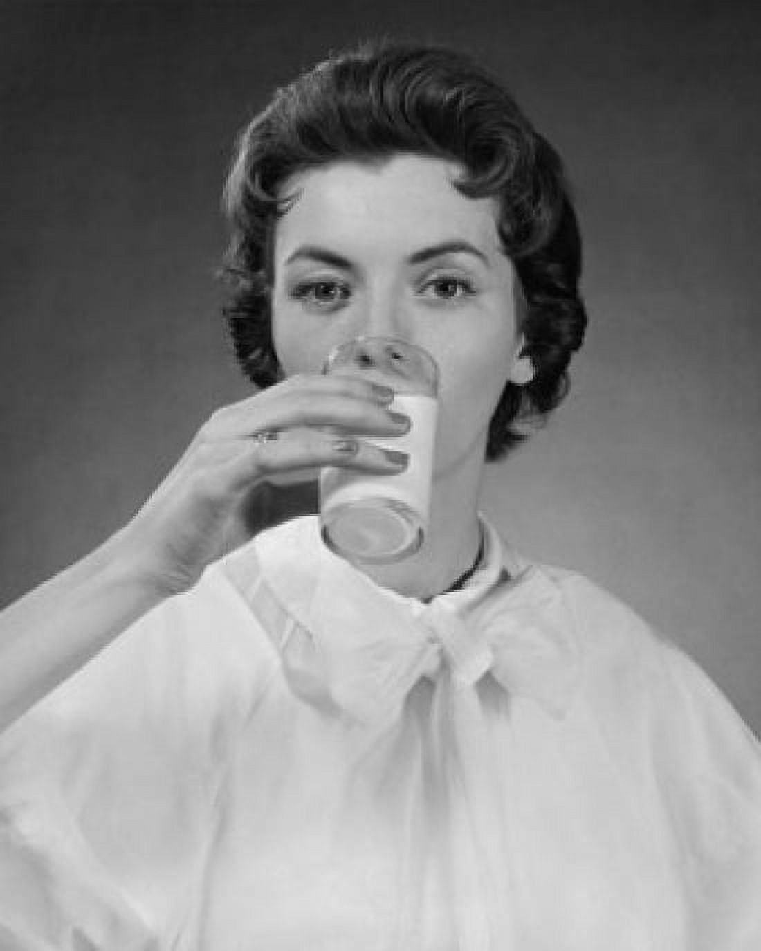 Portrait of a young woman drinking milk Canvas Art - (24 x 36)