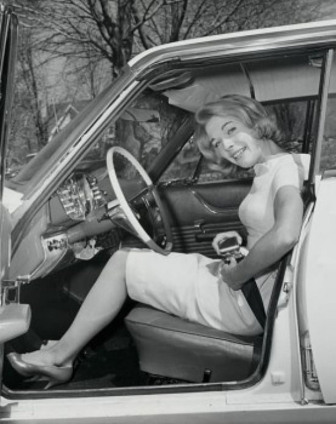 Portrait of a young woman fastening her seat belt in a car Canvas Art - (18 x 24)