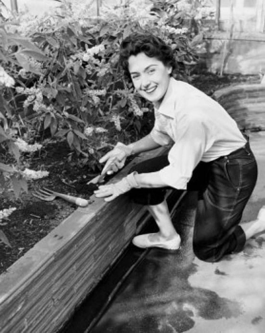 Portrait of a young woman gardening Canvas Art - (24 x 36)
