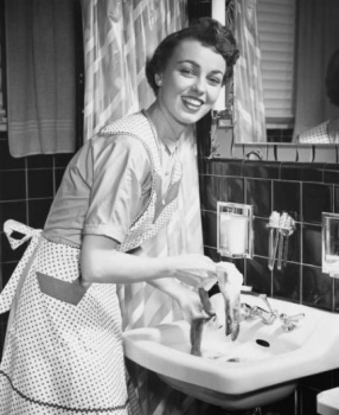 Portrait of a young woman hand washing clothes in the bathroom sink Canvas Art - (24 x 36)