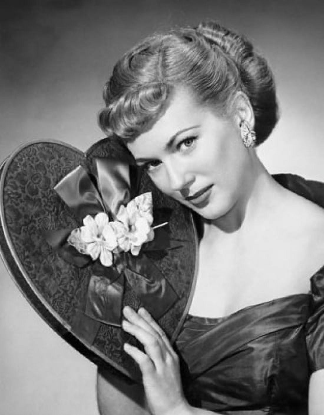 Portrait of a young woman holding a Valentine gift Canvas Art - (24 x 36)