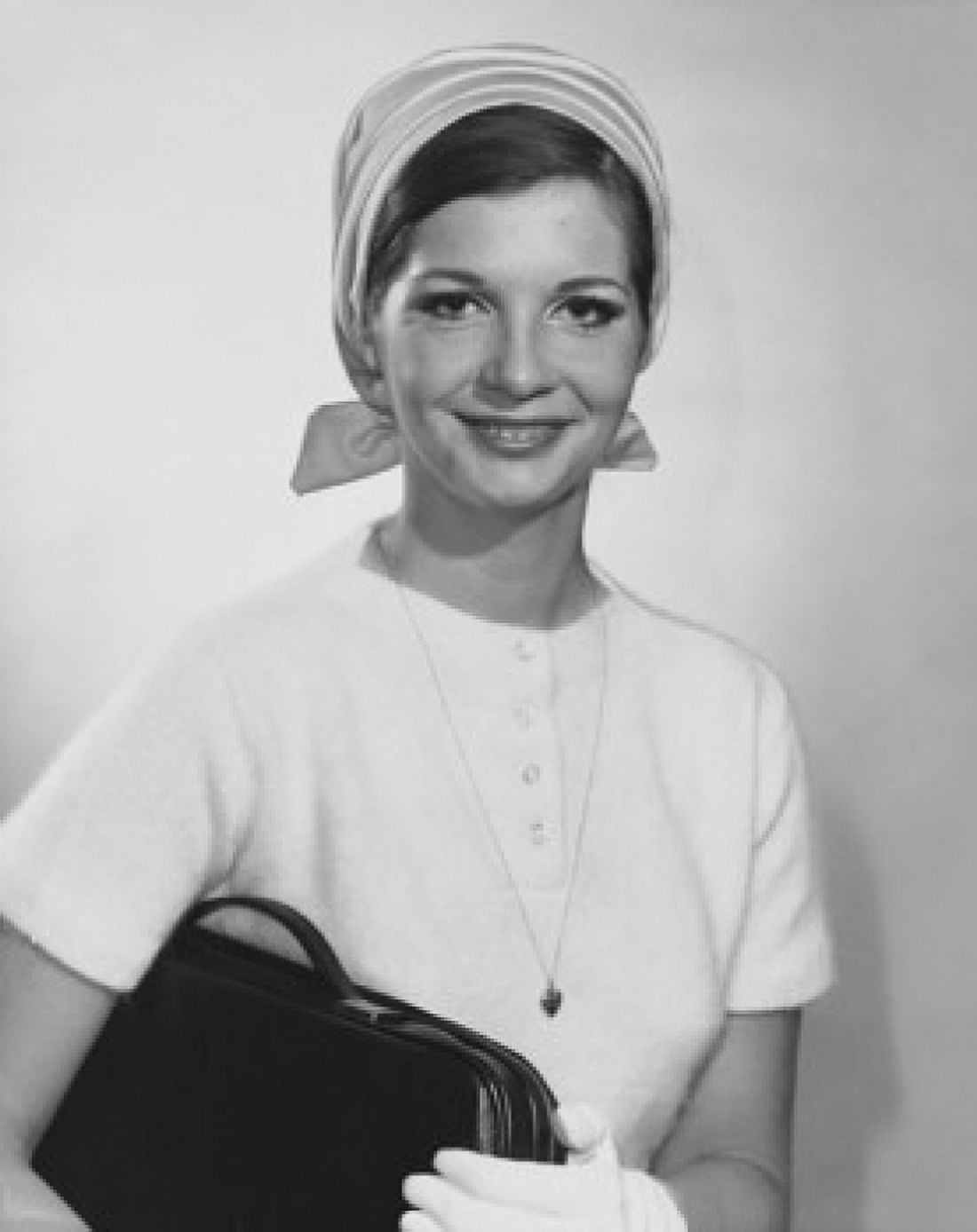 Portrait of a young woman holding a bag Canvas Art - (18 x 24)