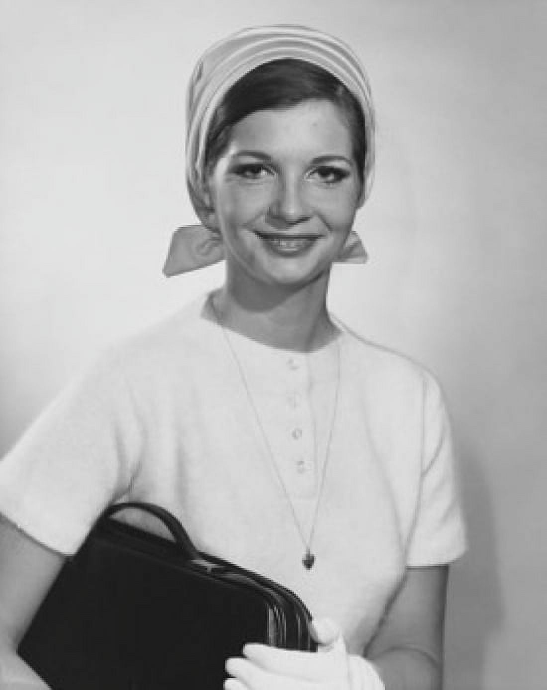 Portrait of a young woman holding a bag Canvas Art - (24 x 36)