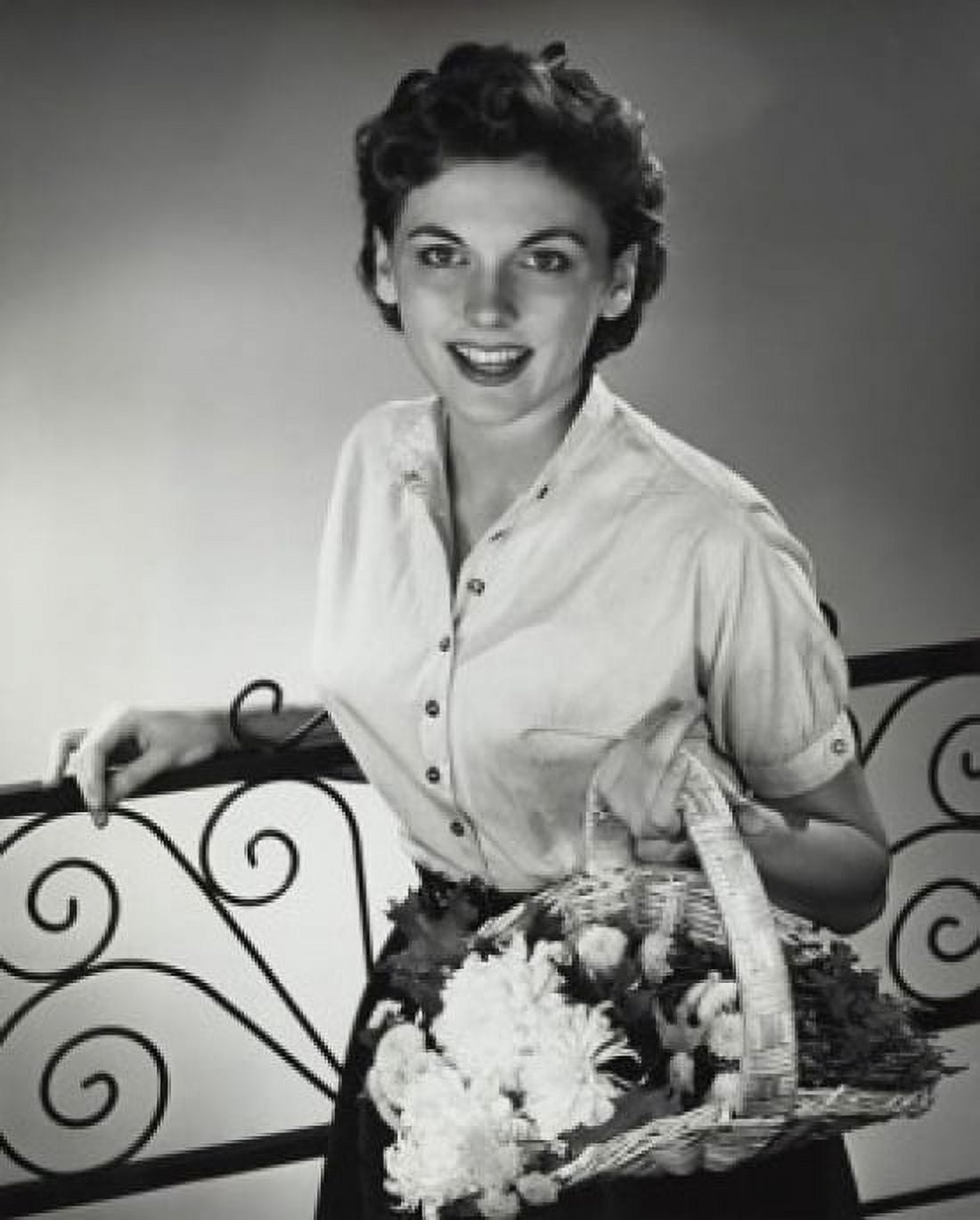 Portrait of a young woman holding a basket of flowers Canvas Art - (18 x 24)