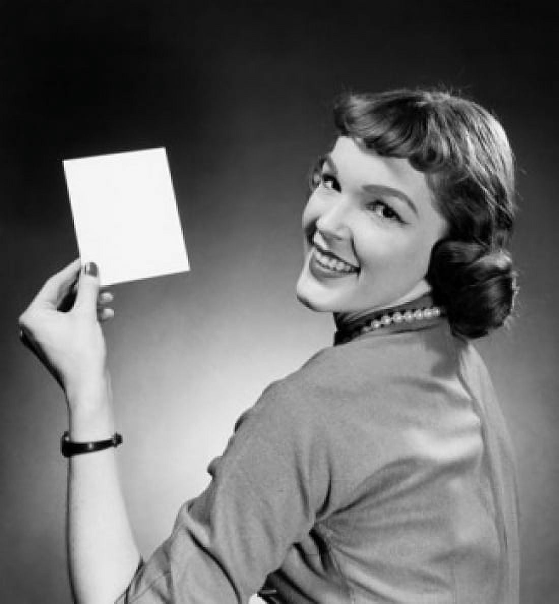 Portrait of a young woman holding a blank flash card Canvas Art - (18 x 24)