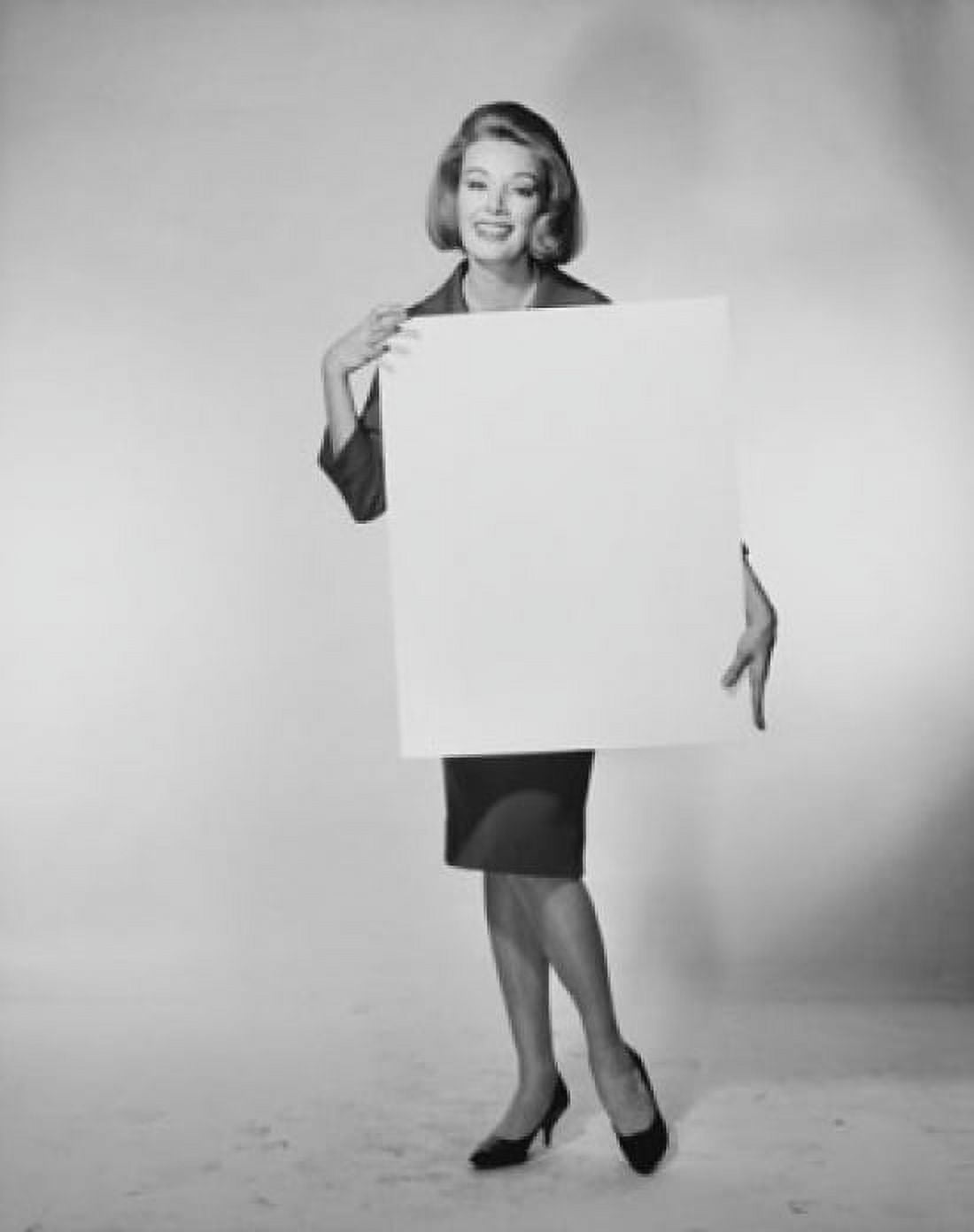 Portrait of a young woman holding a blank placard Canvas Art - (18 x 24)