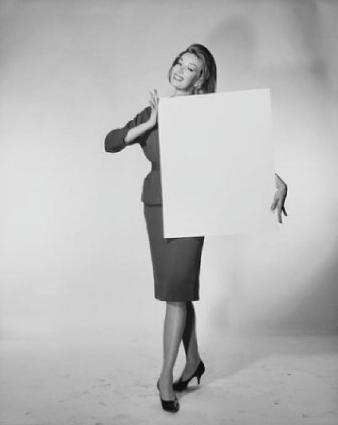 Portrait of a young woman holding a blank placard Canvas Art - (18 x 24)