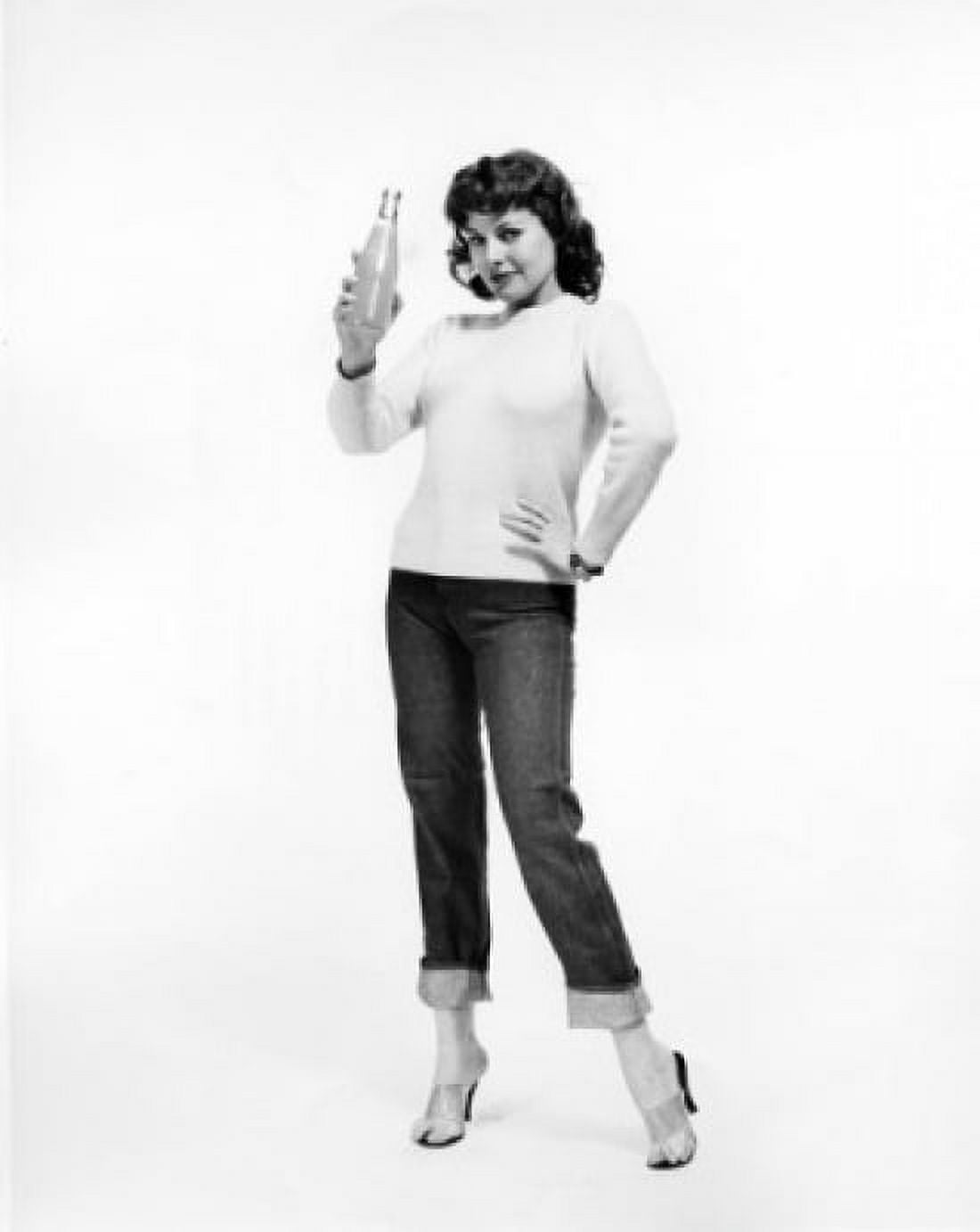 Portrait of a young woman holding a bottle of soda Canvas Art - (24 x 36)