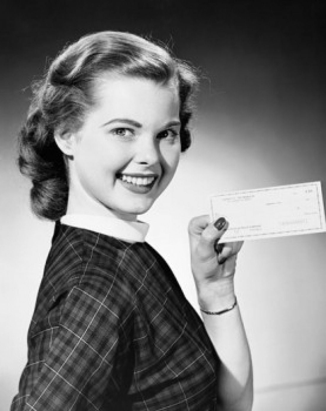Portrait of a young woman holding a check and smiling Canvas Art - (18 x 24)