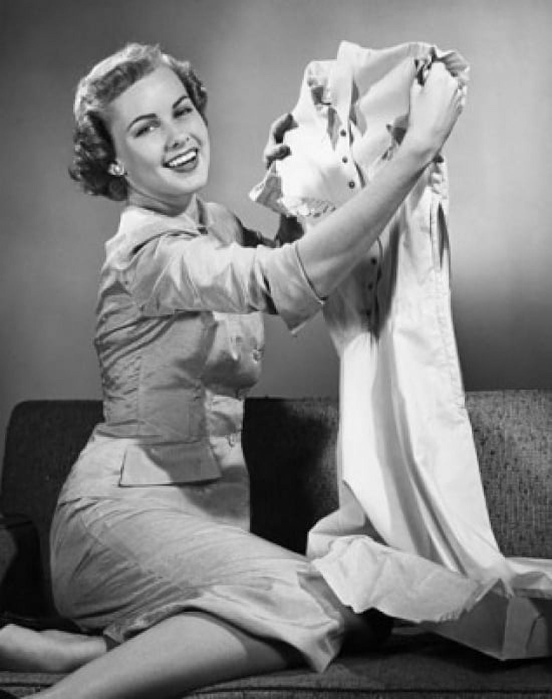 Portrait of a young woman holding a dress Canvas Art - (18 x 24)