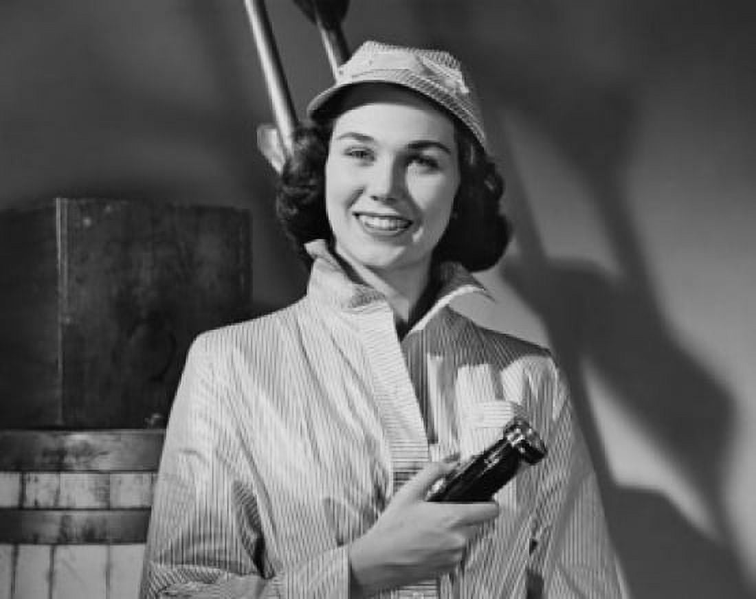 Portrait of a young woman holding a flashlight smiling Canvas Art - (24 x 36)