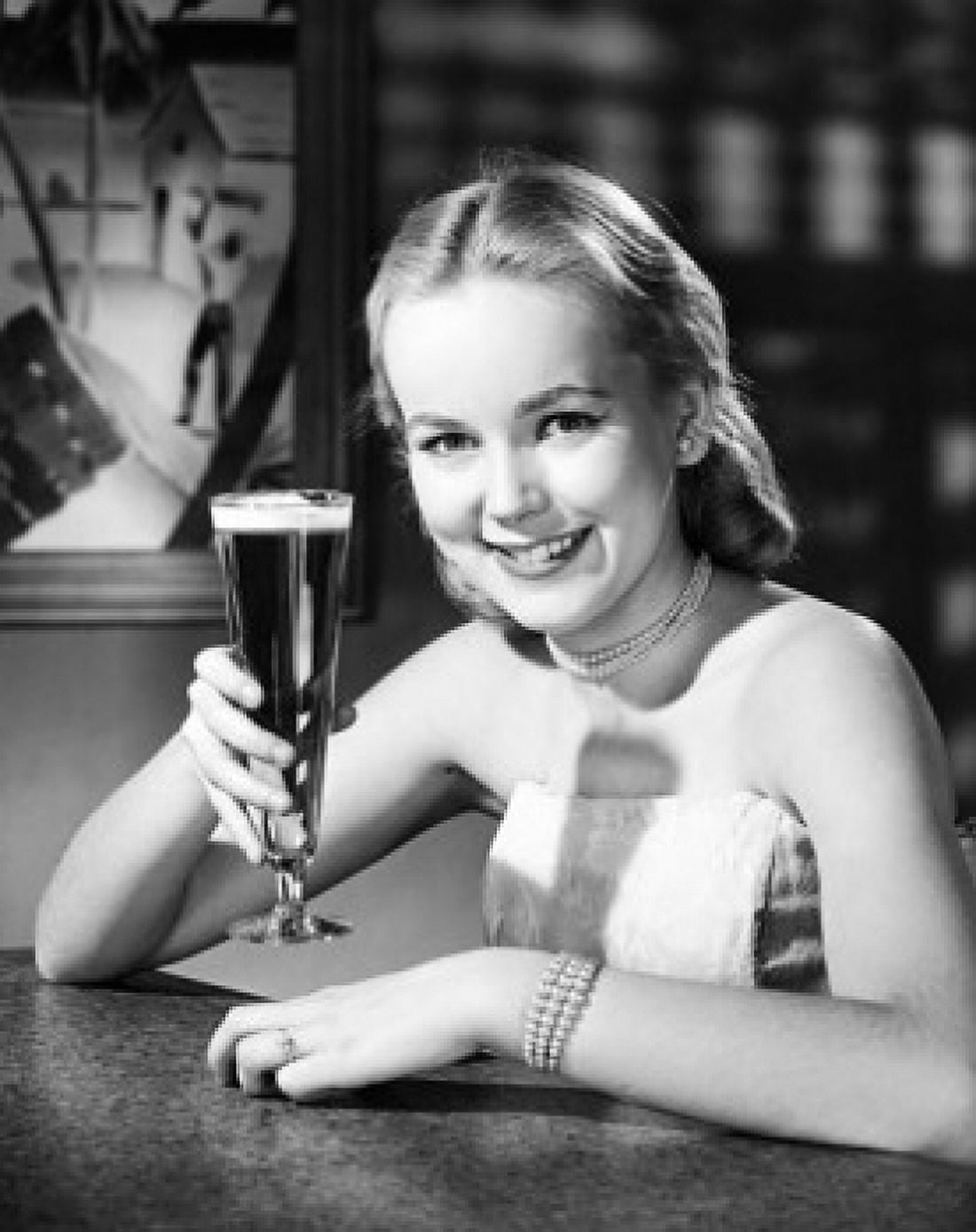 Portrait of a young woman holding a glass of beer Canvas Art - (18 x 24)