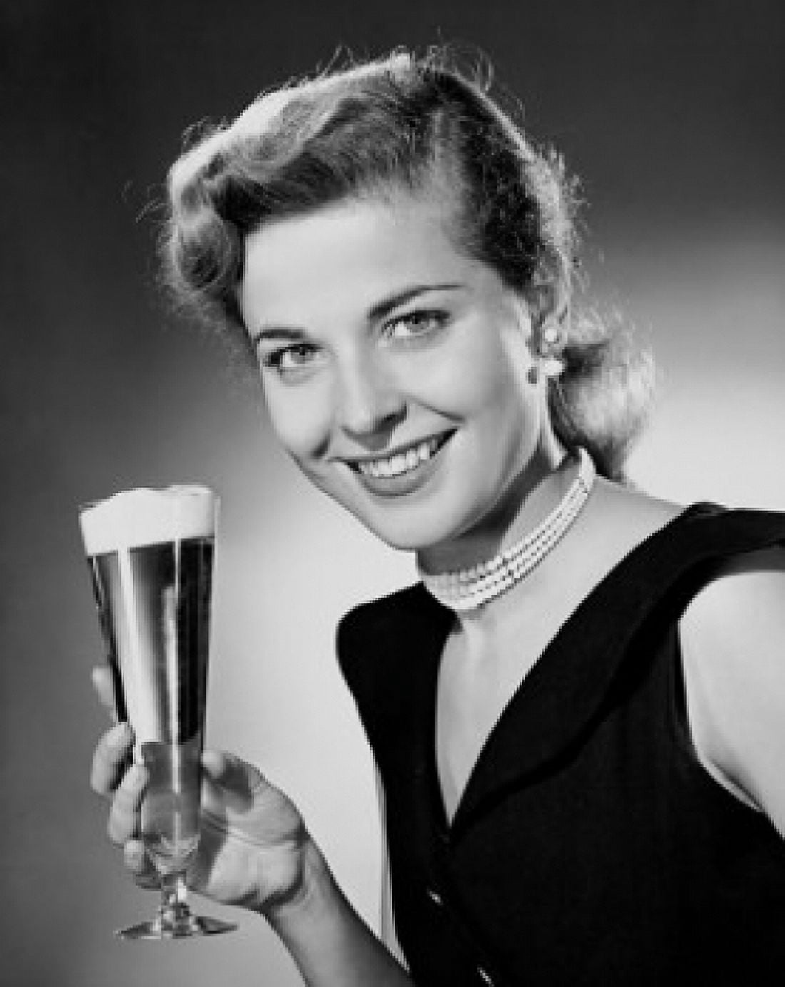 Portrait of a young woman holding a glass of beer Canvas Art - (18 x 24)