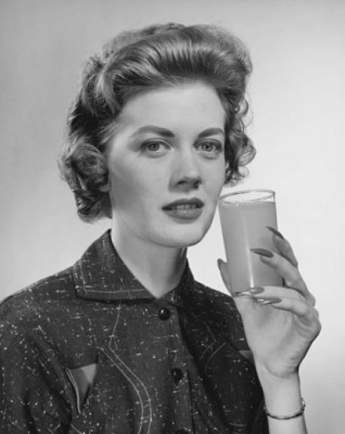 Portrait of a young woman holding a glass of juice Canvas Art - (18 x 24)