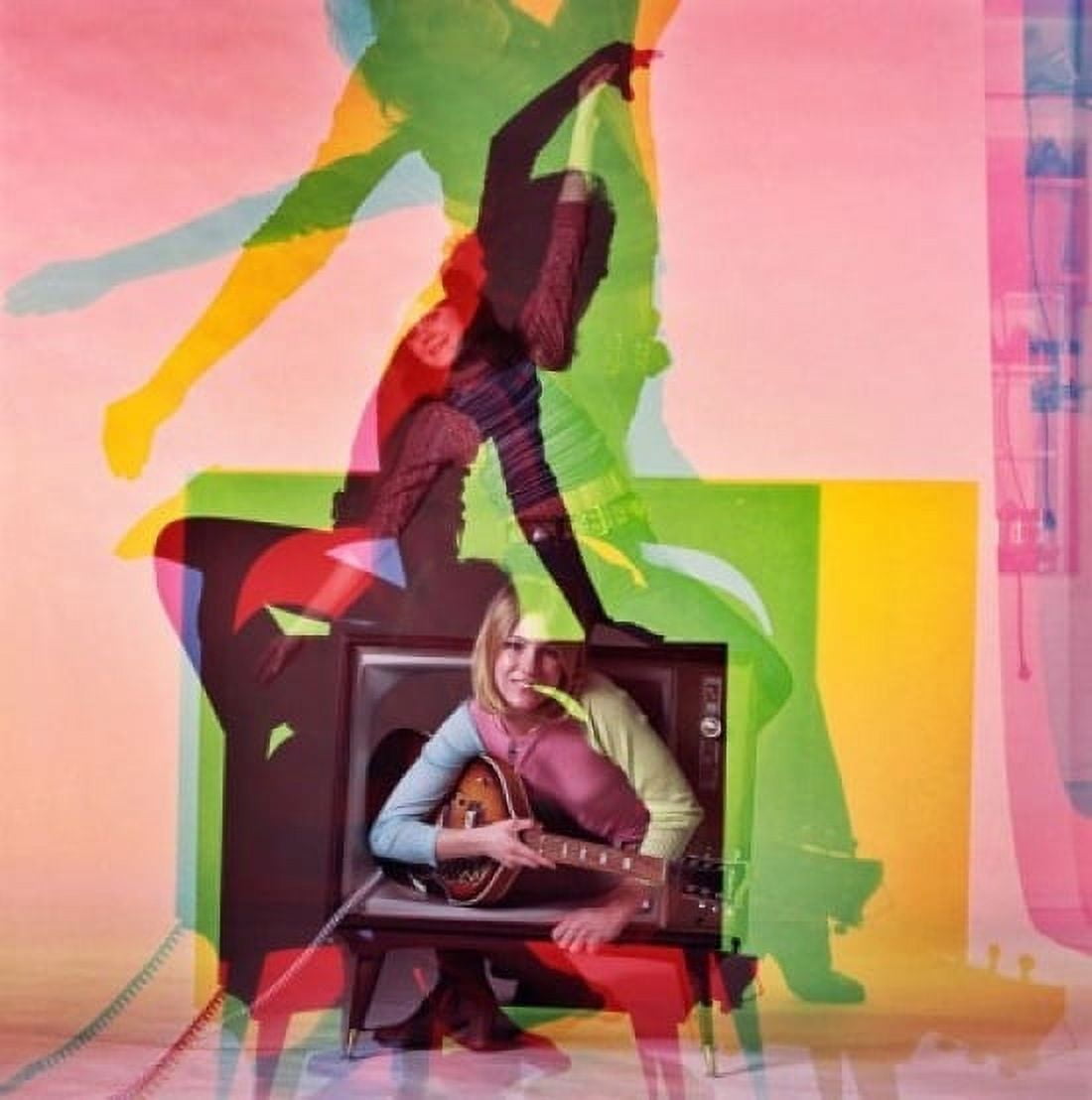 Portrait of a young woman holding a guitar and emerging from a television Canvas Art - (24 x 36)