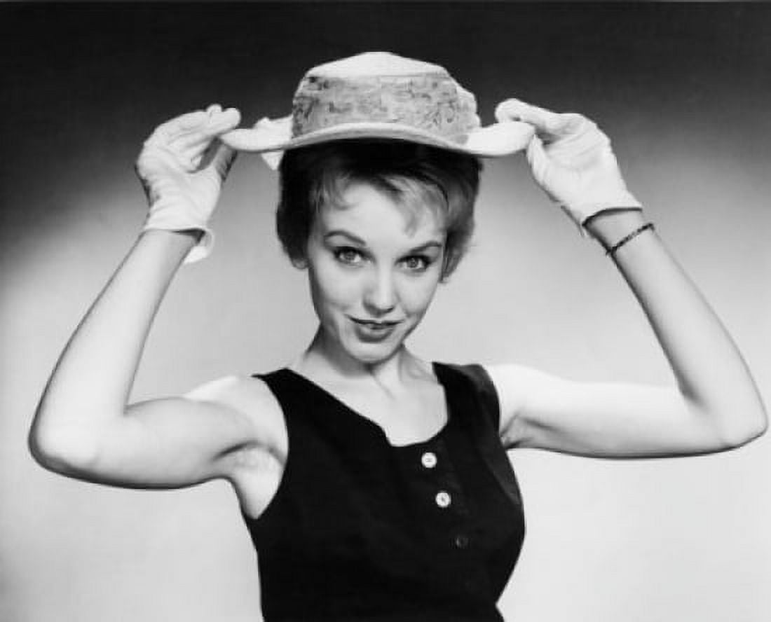 Portrait of a young woman holding a hat Canvas Art - (18 x 24)