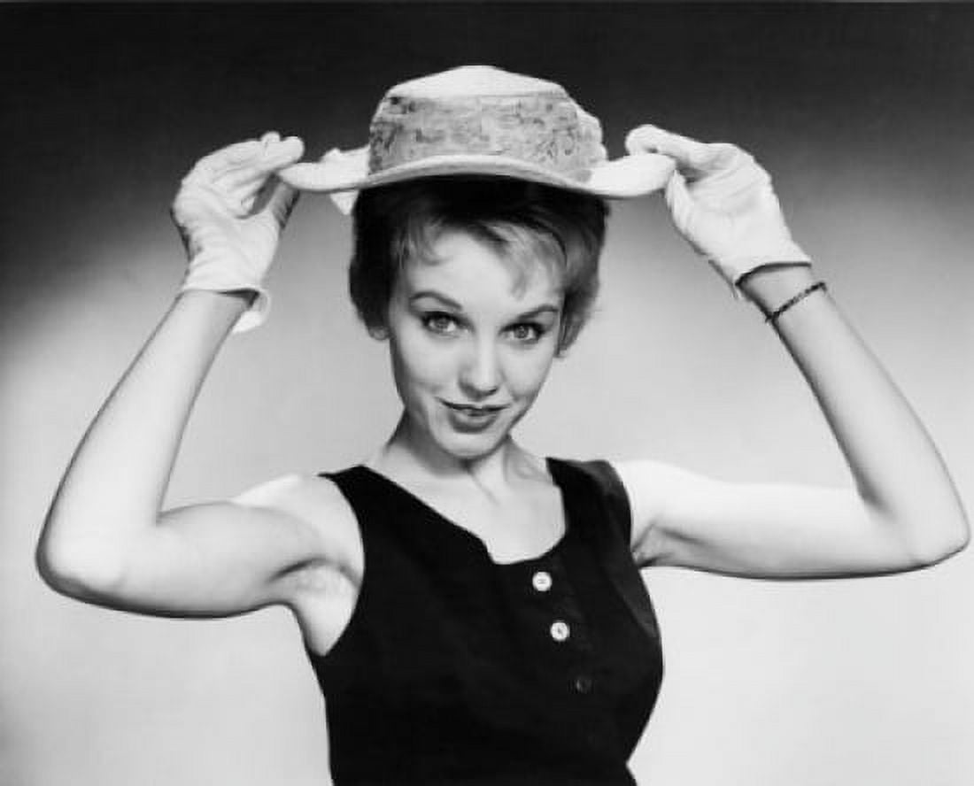 Portrait of a young woman holding a hat Canvas Art - (24 x 36)