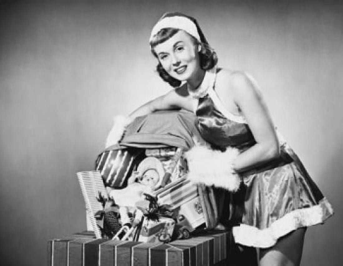 Portrait of a young woman holding a sack of Christmas presents Canvas Art - (18 x 24)