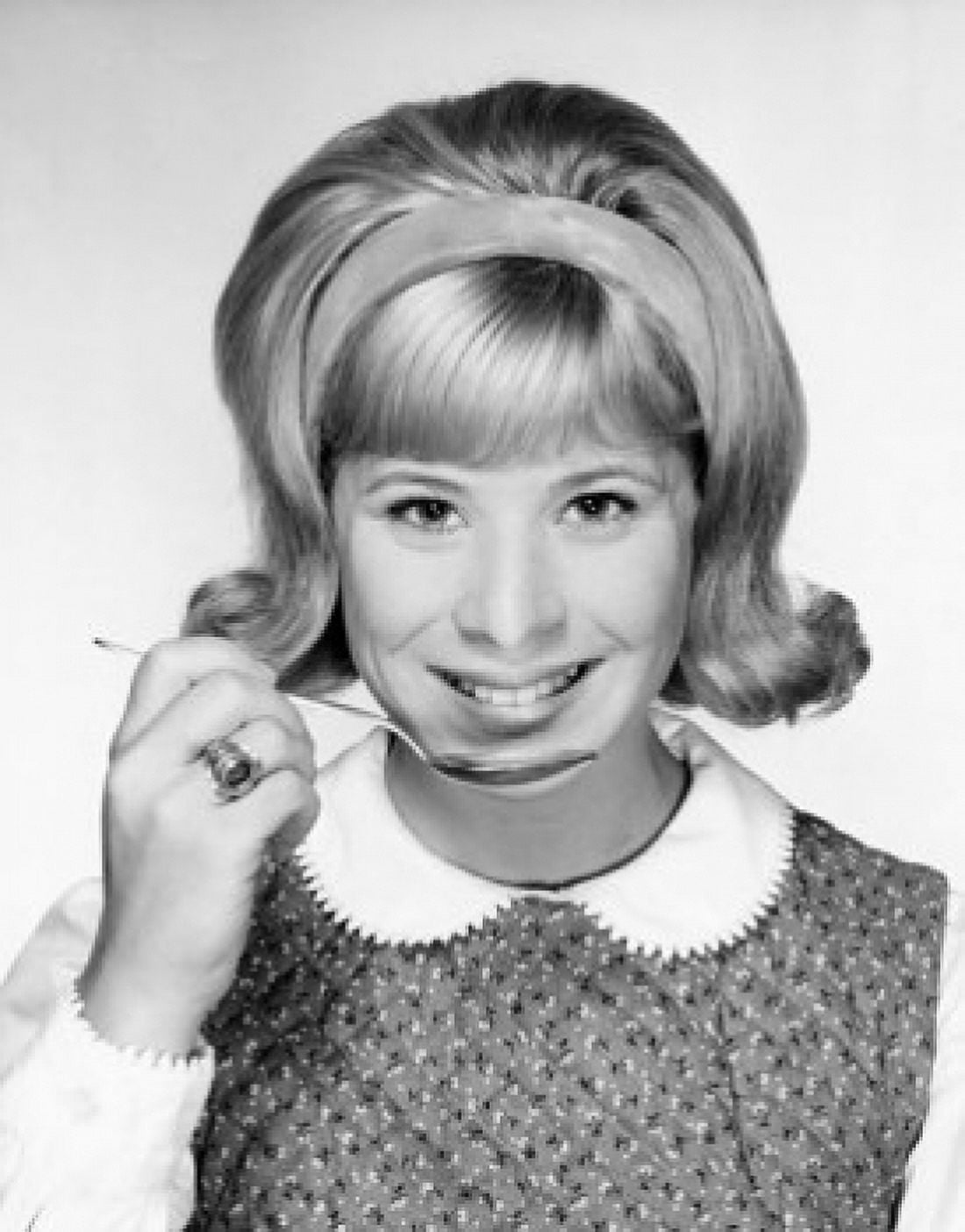 Portrait of a young woman holding a spoon and smiling Canvas Art - (24 x 36)