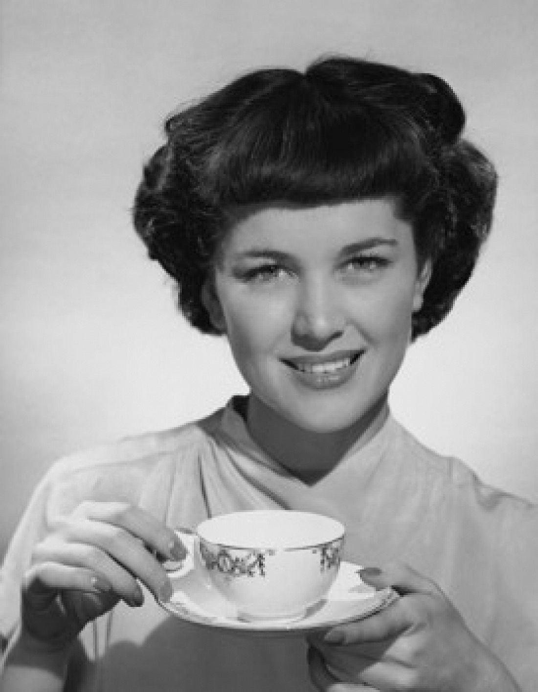 Portrait of a young woman holding a tea cup Canvas Art - (24 x 36)
